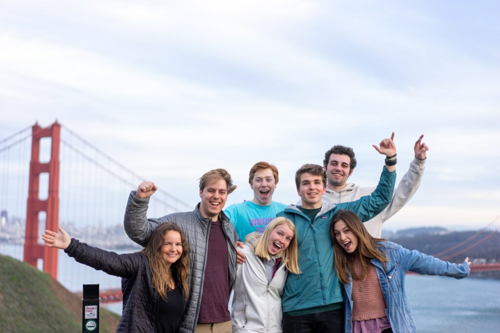 A group family photo by the Golden Gate Bridge.