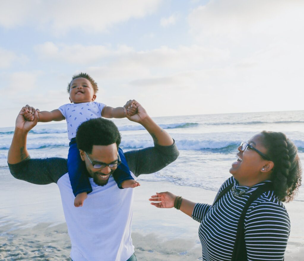 A family laughs and shows personality in their photos.