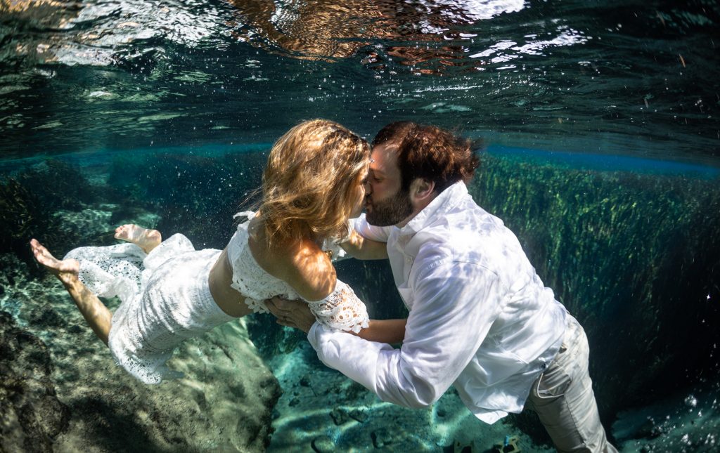 Underwater photos for a wedding are an unforgettable experience.