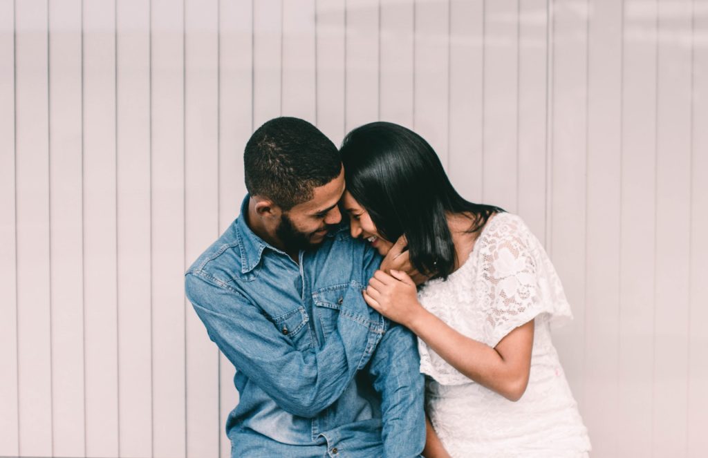 Couple sharing a tender moment, capturing the intimacy and joy of their engagement