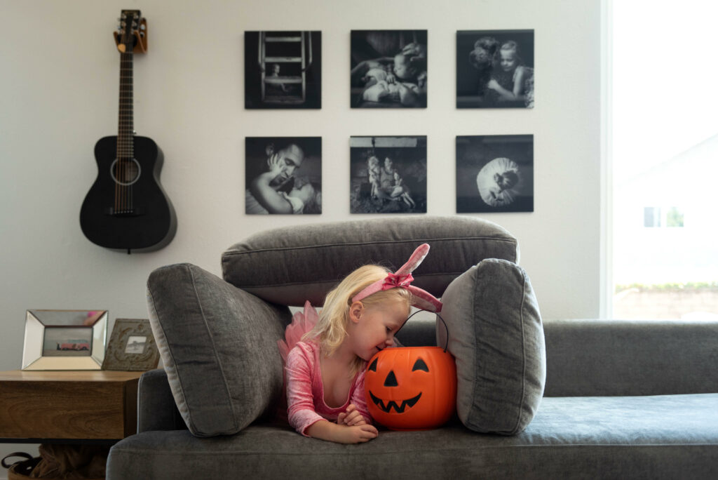 A black and white gallery wall in a living room.