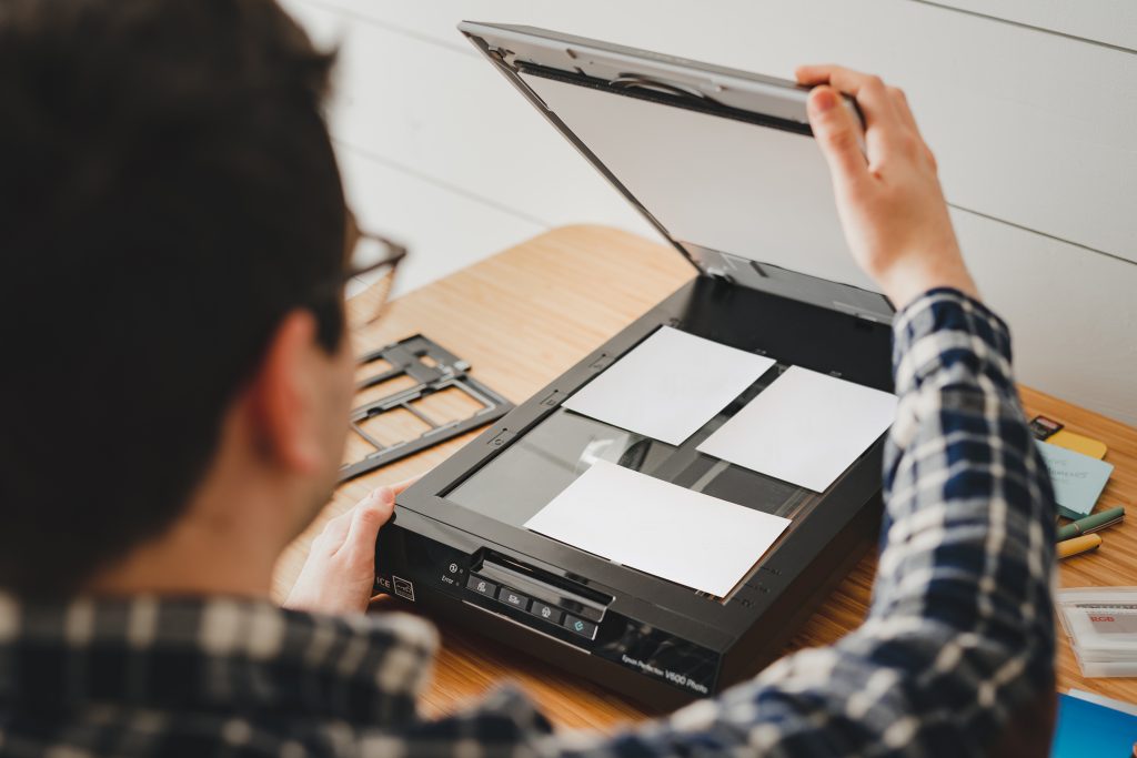 Use a photo scanner to scan photos