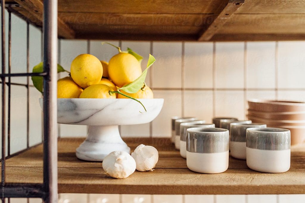 Layer in candles and fruit for bar cart styling