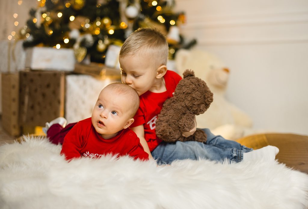 Baby and child in family photo shoot