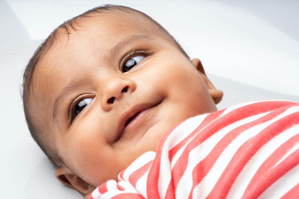 smiling baby first christmas photo shoot