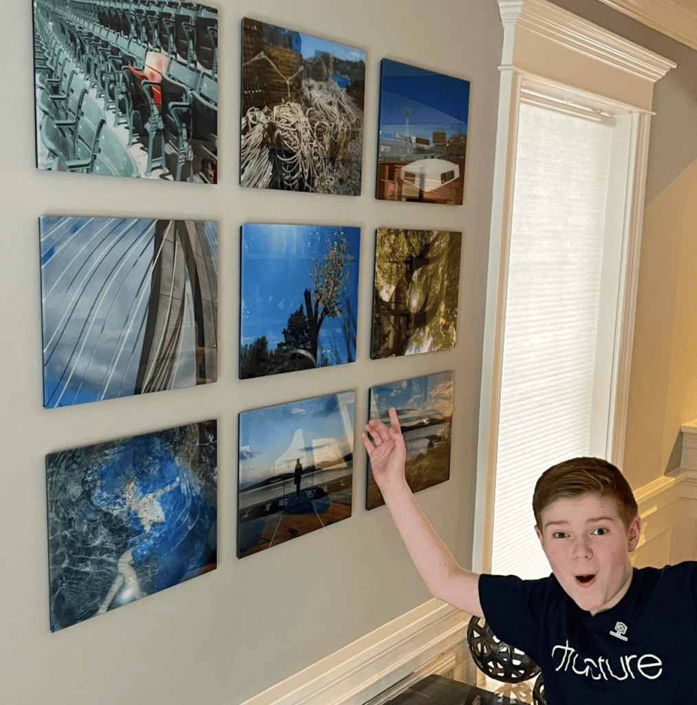 Pablove Shutterbug Colby showing off his photos printed on glass with Fracture.