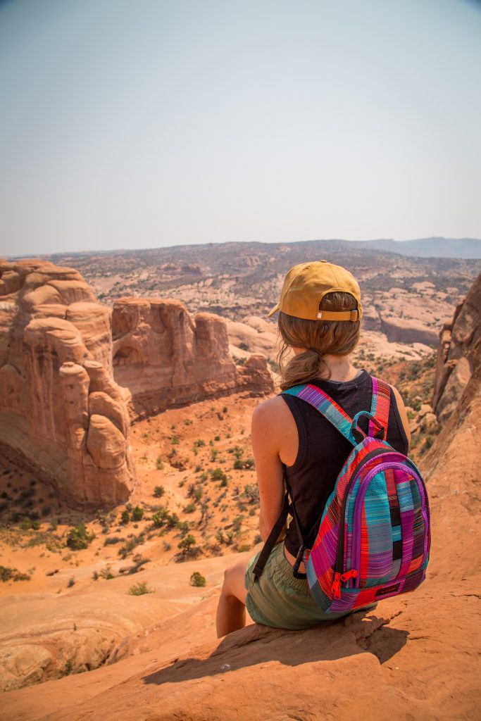 Sit along a scenic overlook for great travel portraits