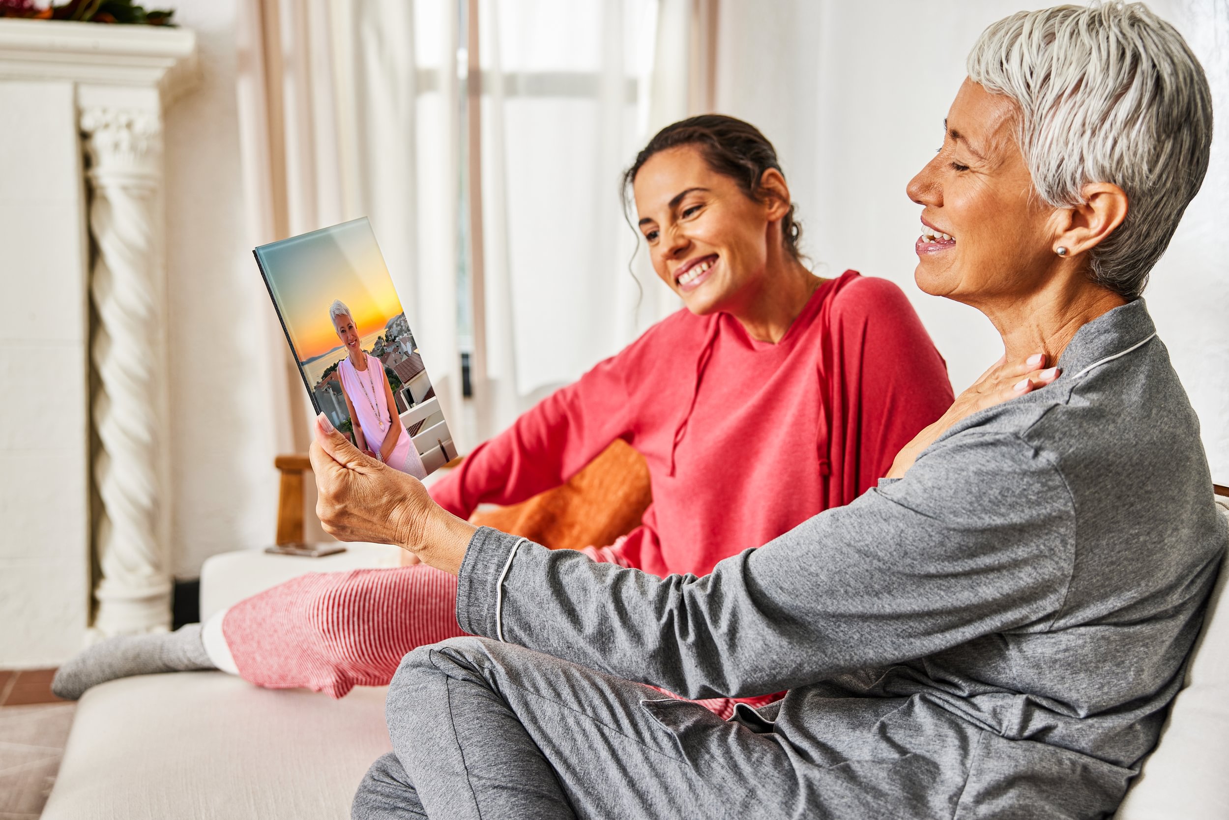 A daughter gifts her mom a glass print from her favorite trip for Mother's Day, and her mom is touched and surprised by the personalized photo gift.