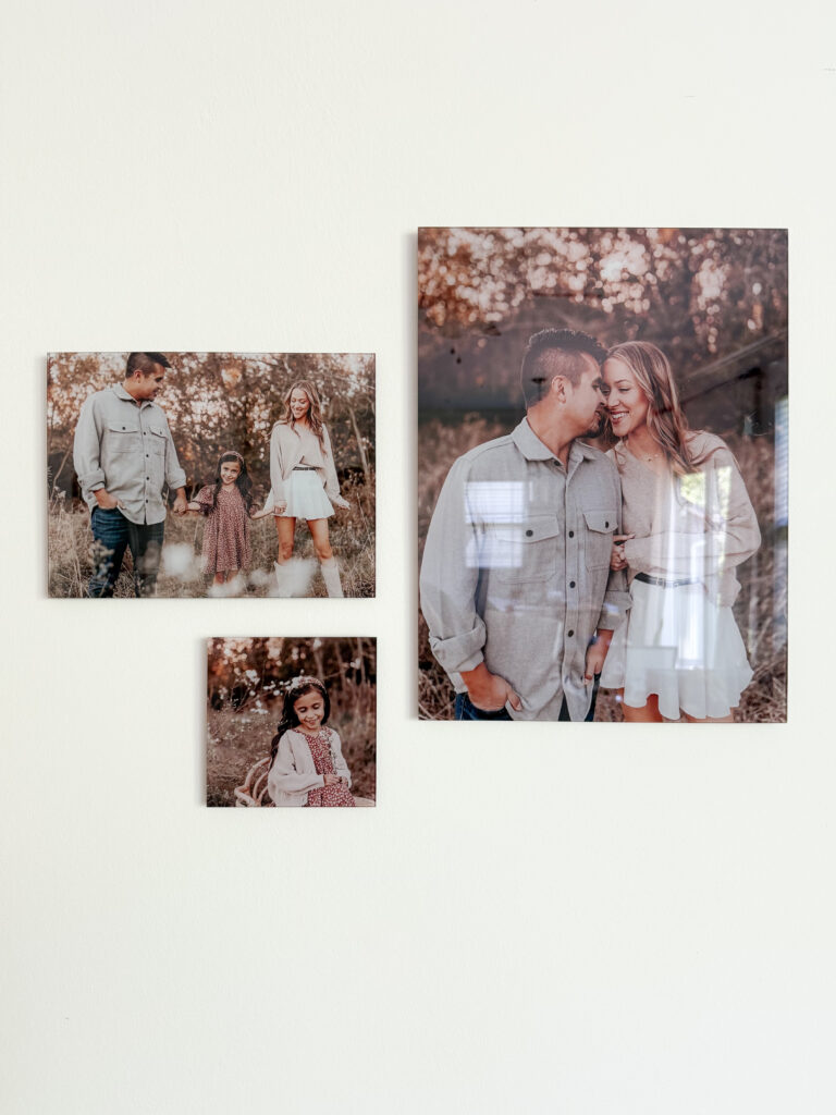 A set of beautiful Mother's Day family portraits printed on glass, mounted in a cluster layout for an organic feel on the wall.