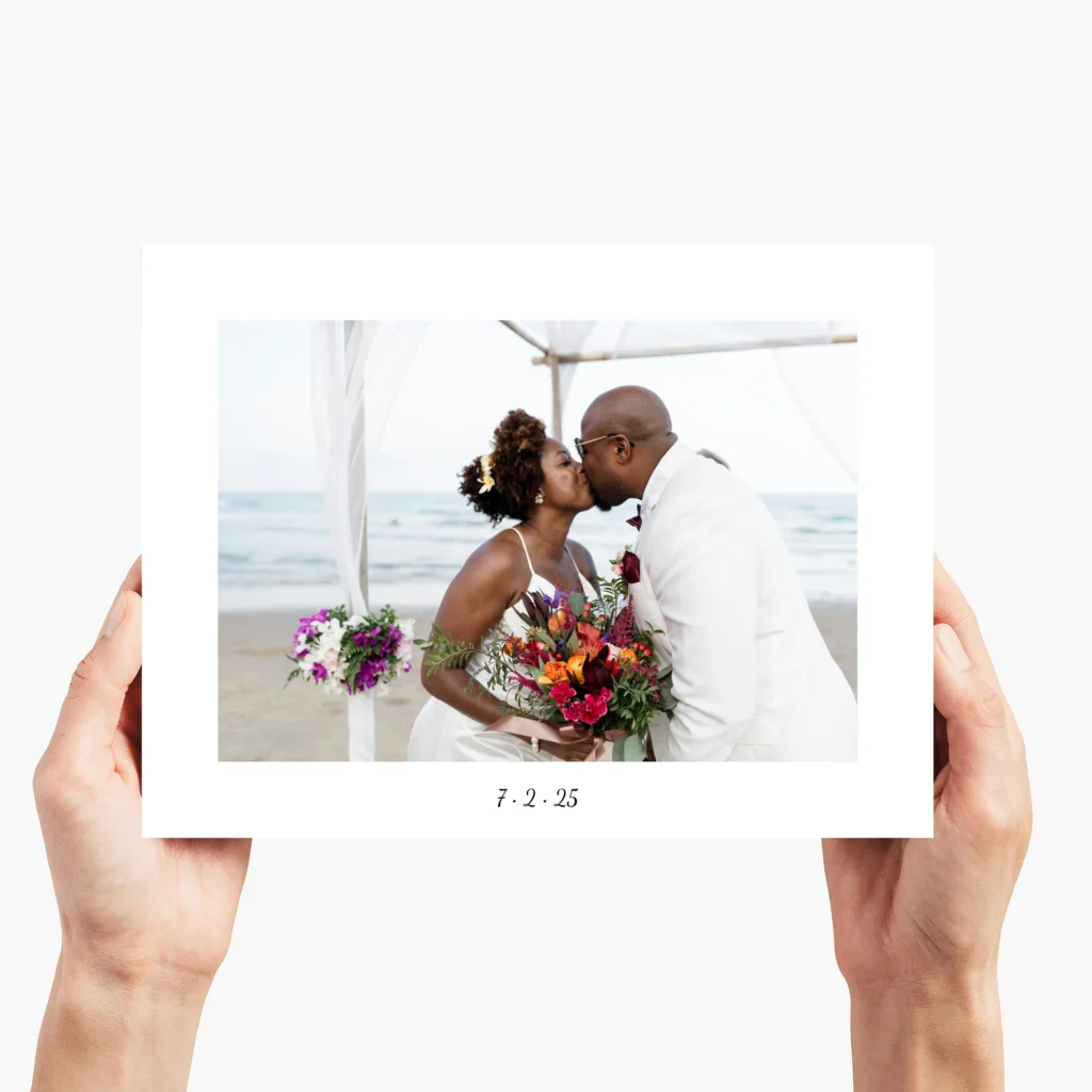 Wedding photo of couple kissing with stunning bouquet, vibrantly printed on glass—featuring a white border with custom text showcasing their wedding date.