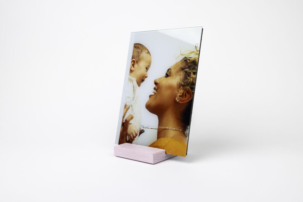 The limited edition Mother's Day blush pink Premium Wood Stand from Fracture, designed to elevate your small and extra small glass prints on any tabletop or surface. 